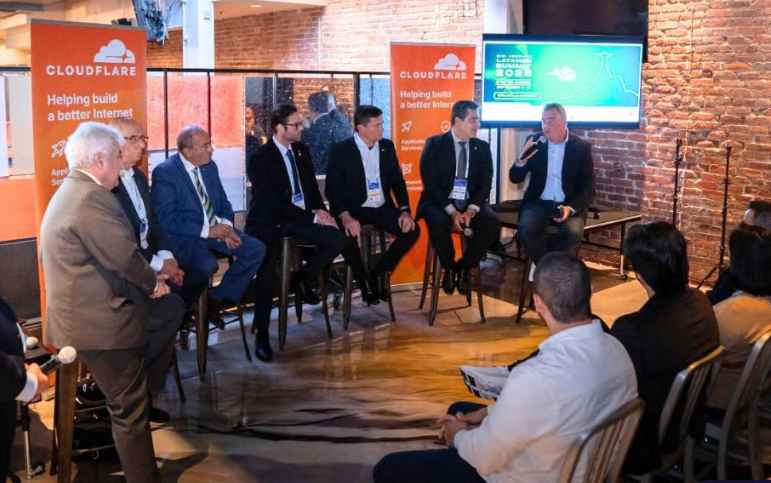 Participants in a conference panel discussion.
